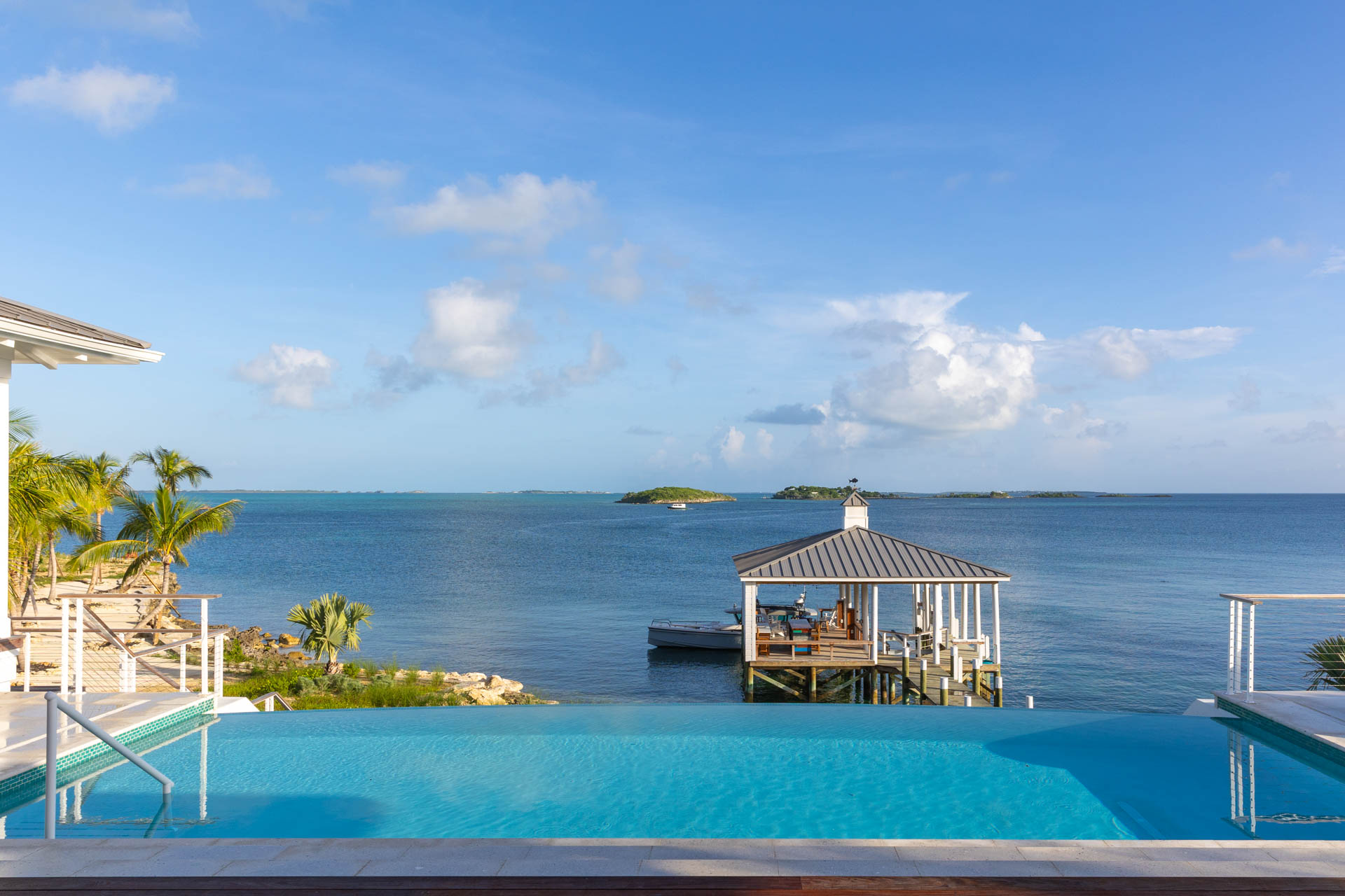 Tropical luxury interior design in Abaco Cay, Bahamas villa by Studio M, blending indoor-outdoor living with island-inspired decor