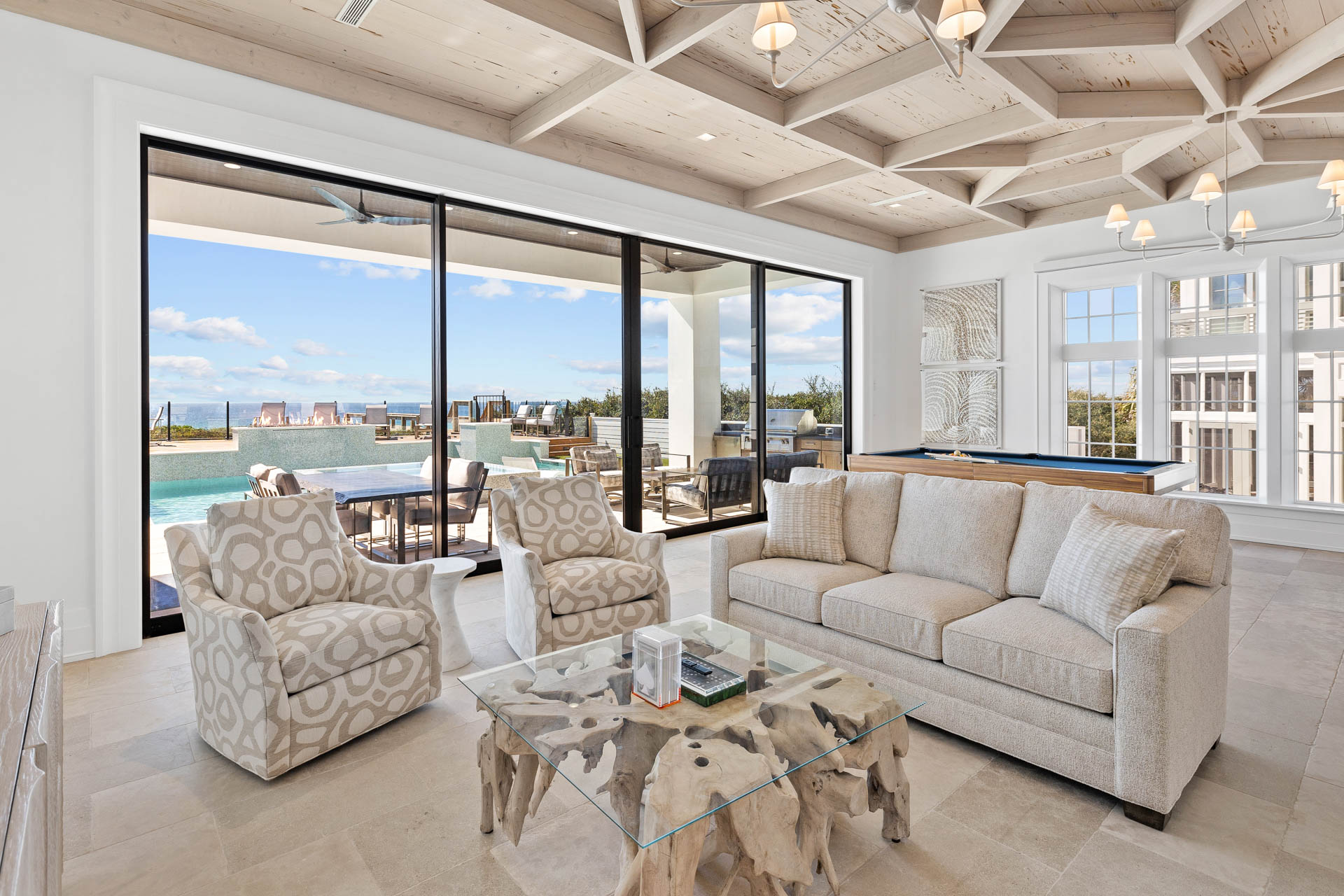 Celebrity-approved Destin interior design by Studio M features hand-hewn beams and innovative materials across 14,000 square feet of coastal luxury