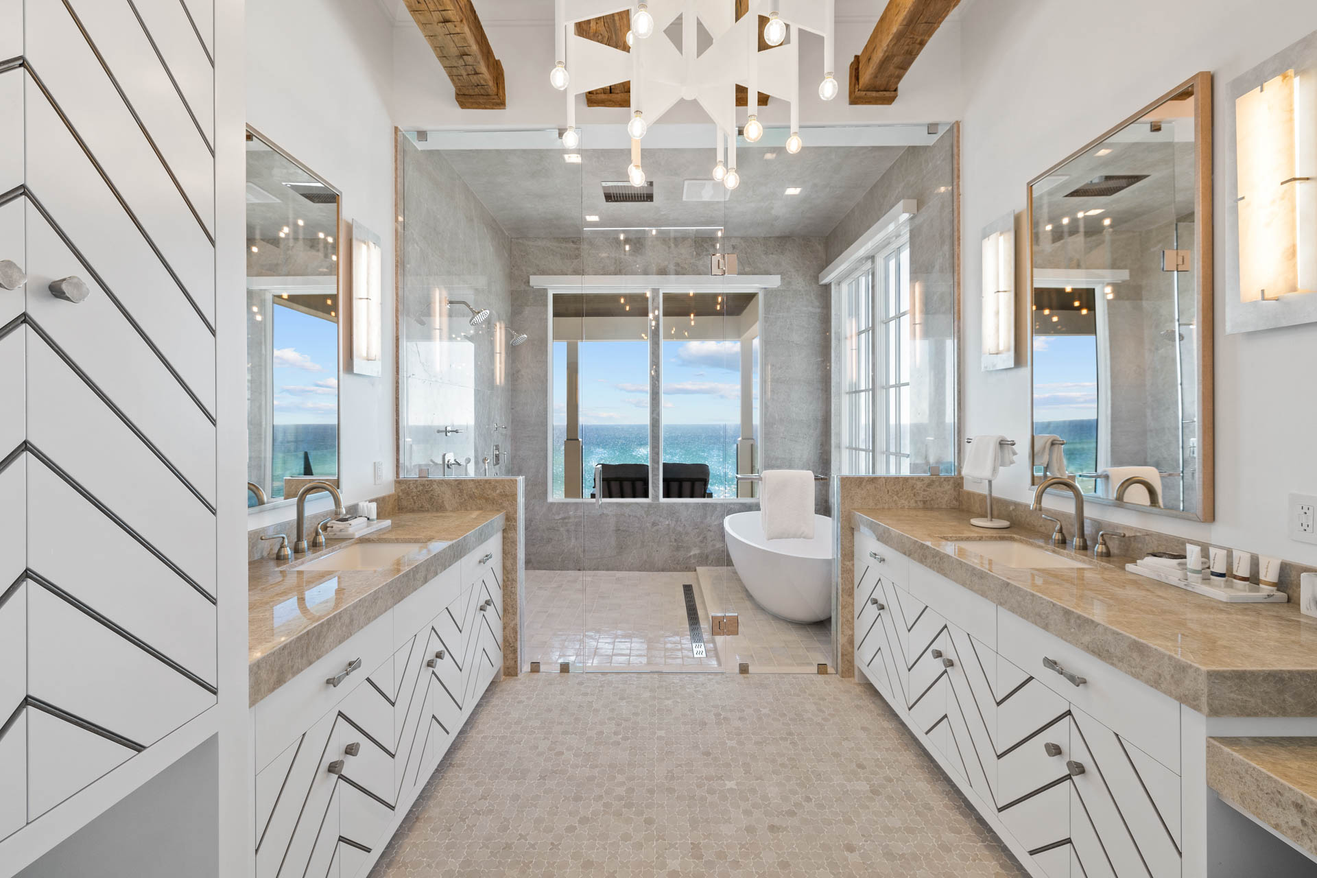 Celebrity-approved Destin interior design by Studio M features hand-hewn beams and innovative materials across 14,000 square feet of coastal luxury