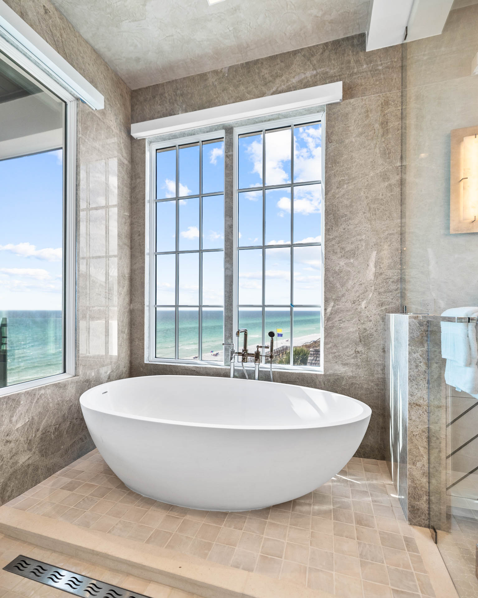 Celebrity-approved Destin interior design by Studio M features hand-hewn beams and innovative materials across 14,000 square feet of coastal luxury